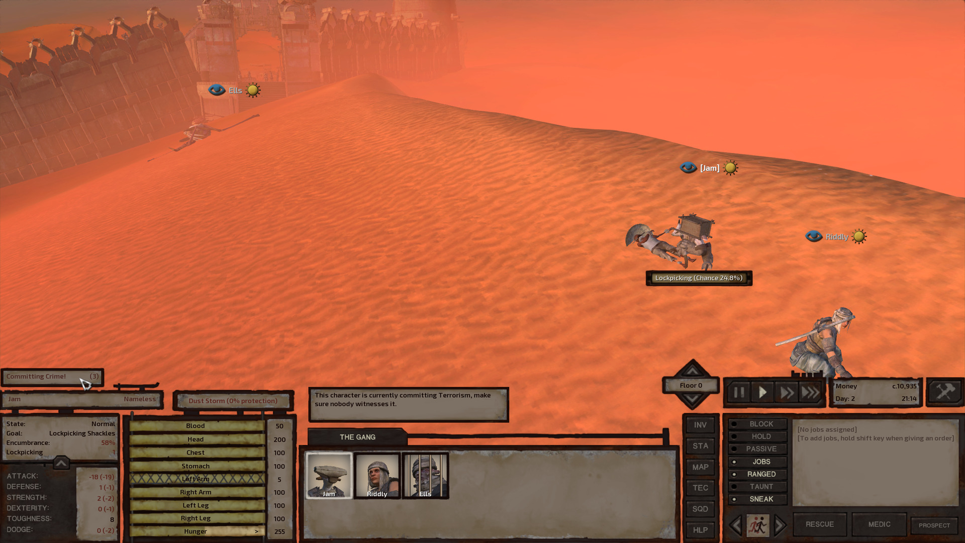 Jam crouches over the enslaved man, picking the lock on his shackles. A progress bar reads 'Lockpicking (Chance 24.8%)'. They're close enough to Show-Battai that the city gates can be seen clearly in the background, though a raging dust storm makes long range vision less than clear. A text box informs us: 'This character is currently committing Terrorism, make sure nobody witnesses it'.