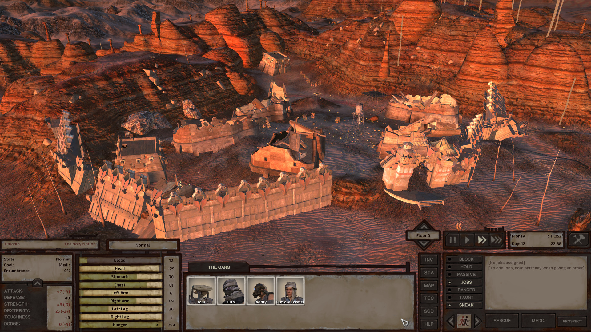 A destroyed city in a badlands valley. Most buildings are reduced to rubble; only a couple smaller houses stand. Here and there, the walls are broken, in places completely missing and in places looking like they've been pushed over or like they are sinking into the sand.