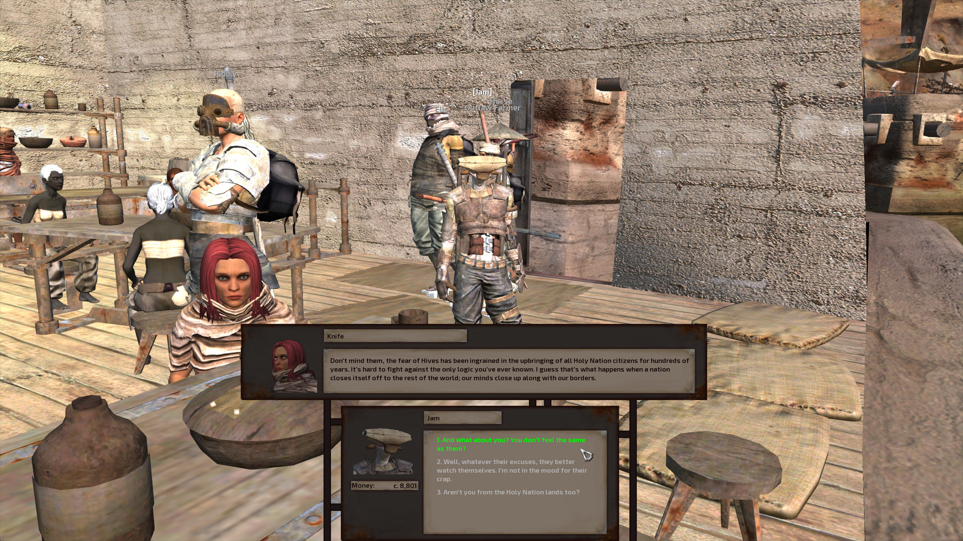 A tan human woman with shoulder-length bright red hair sits at a bar table, talking with Jam. Behind them are the rest of the gang, as well as a couple charcoal-skinned human women sitting at another table.