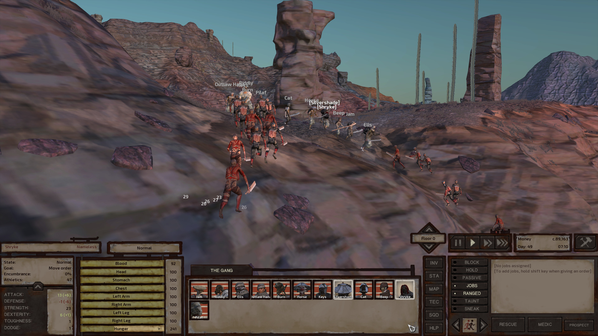 The gang stands ready for battle on a plateau atop rocky bluffs. Cannibals run up the bluffs at them from two directions, making sort of a V shape.