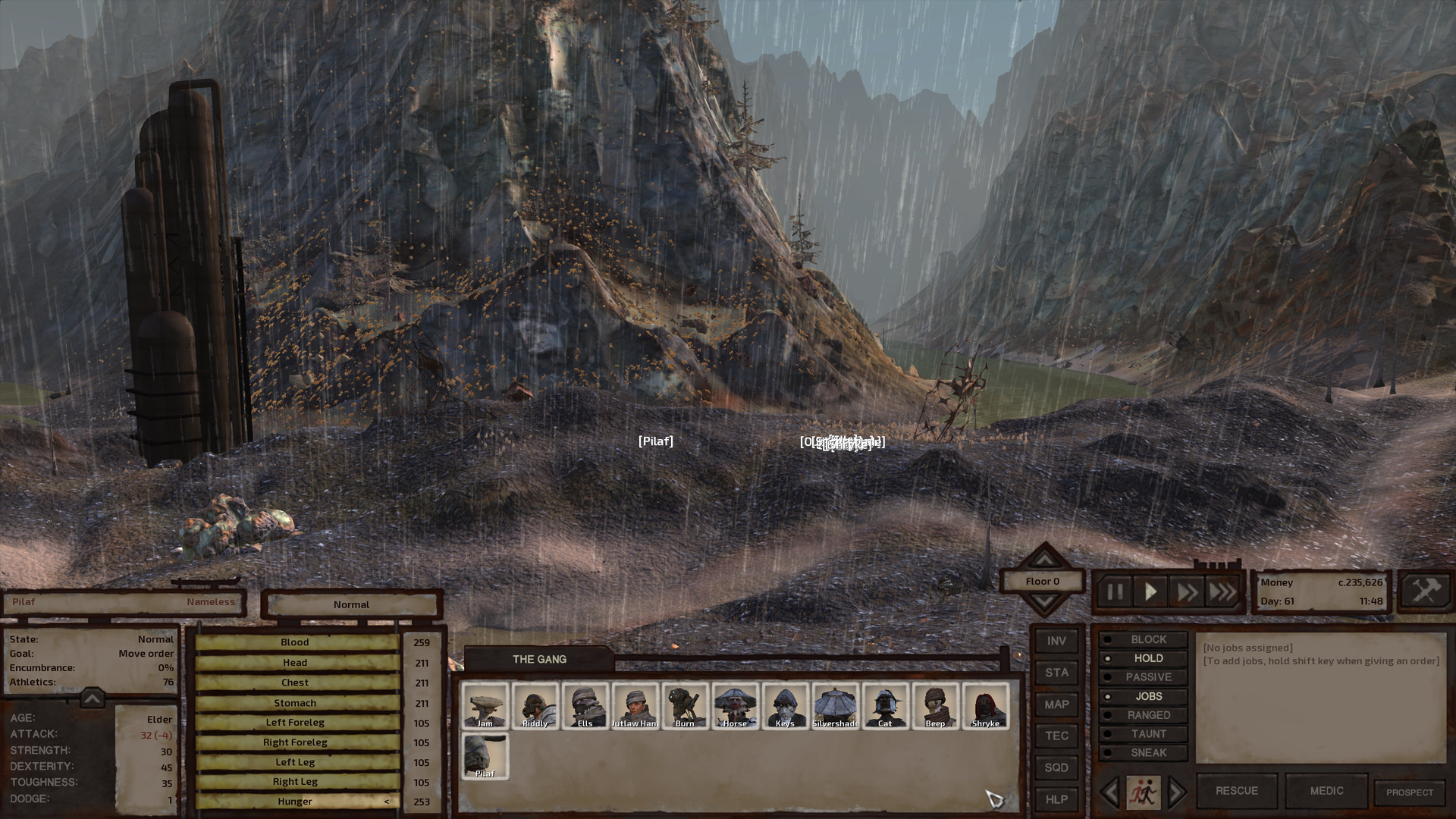 Past a foreground of bumpy, rocky land and a towering disused storage tank, two mountainous cliffs border a green river. Not much of the river can be seen: It rounds a bend and disappears behind one of the cliffs, meandering toward a high mountain ridge in the background, only faintly visible through the driving rain.