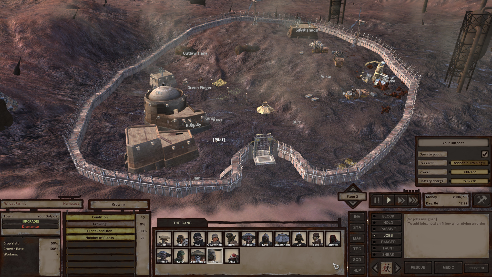 An aerial shot of the base. The whole thing is enclosed by a vaguely circular ring of beige and white metal wall with an indentation that would make one walk for a brief stretch between parallel walls to approach the tall portcullis gate. Passing through the gate, one would be met with a circular tent directly in front of them with a row of buildings to their left and a hill to their right with all the mining and refining machines perched on top. 