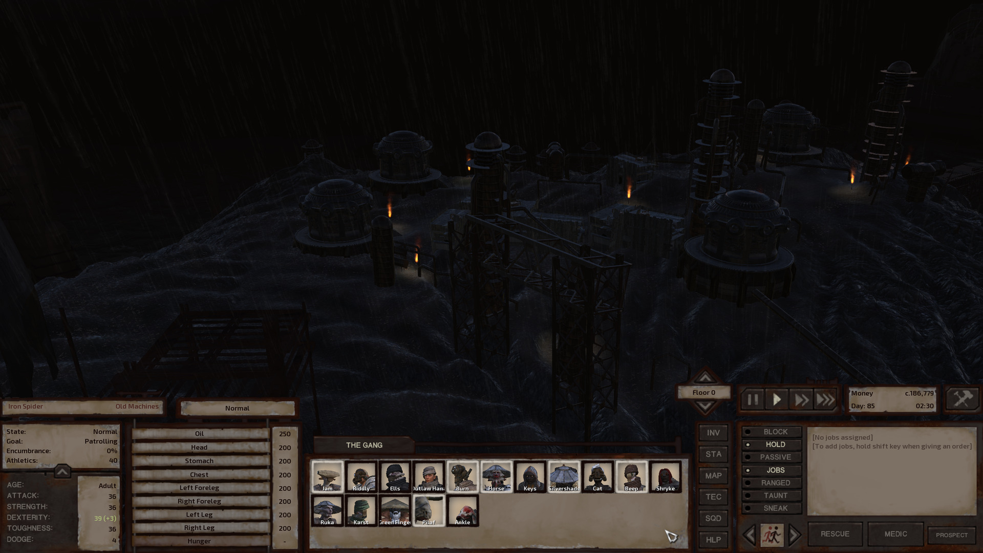 Small gouts of orange flame dot a scene of otherwise exclusively dark grey under a pitch black sky. Four metal domed-roof buildings stand atop a hill between towering siloes, the ringed dome tops of the latter providing aesthetic consistency. The flames come from torches that serve as streetlights. At the edge of town, some disembodied scaffolding stands several storeys high, ruined remains of something-or-other that have long outlived their context.